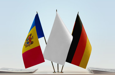 Flags of Moldova and Germany with a white flag in the middle