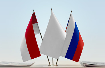Flags of Monaco and Russia with a white flag in the middle
