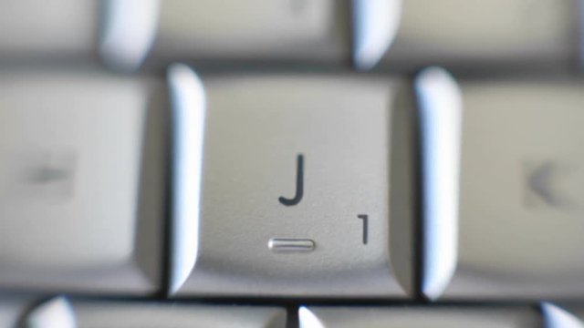 Zoom on J letter on a keyboard.