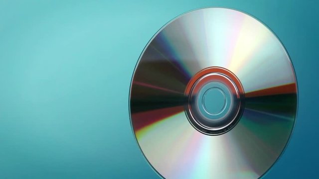 A DVD disc revolves and turns.