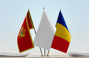 Flags of Montenegro and Romania with a white flag in the middle