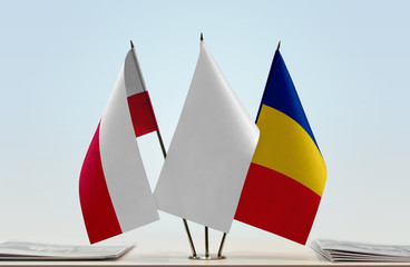 Flags of Poland and Romania with a white flag in the middle