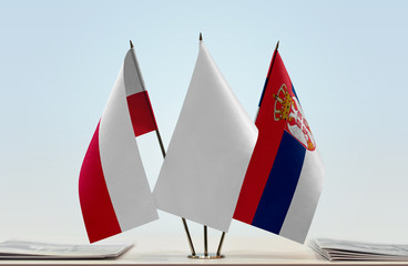 Flags of Poland and Serbia with a white flag in the middle