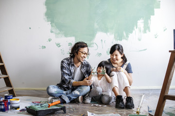 Asian family renovating the house