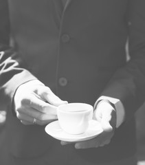 Businessman holding coffee cup