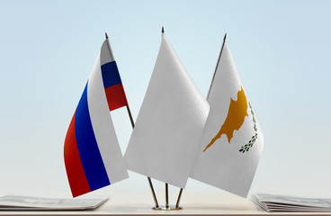 Flags of Russia and Cyprus with a white flag in the middle