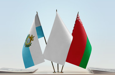 Flags of San Marino and Belarus with a white flag in the middle