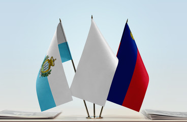 Flags of San Marino and Liechtenstein with a white flag in the middle