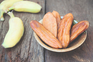 Dried banana, Dried fruit on wooden table, Food and Healthy concept