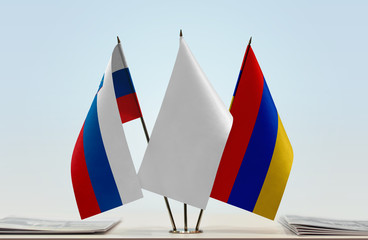 Flags of Slovenia and Armenia with a white flag in the middle