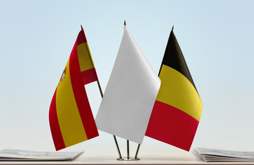 Flags of Spain and Belgium with a white flag in the middle