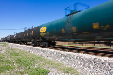 Fototapeta na wymiar zipping by dual railroad tracks