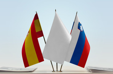 Flags of Spain and Slovenia with a white flag in the middle