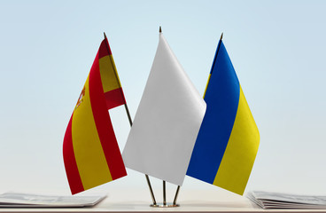 Flags of Spain and Ukraine with a white flag in the middle