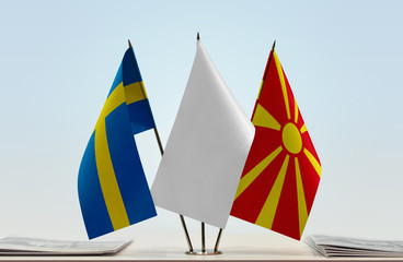 Flags of Sweden and Macedonia with a white flag in the middle