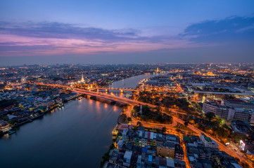 Fototapeta na wymiar Sunset Scene with Phra Phuttha Yodfa Bridge, Memorial Bridge and Chao Praya River in Bangkok