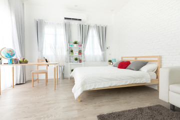 King-size bed in bright bedroom