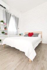 King-size bed in bright bedroom