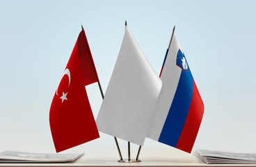 Flags of Turkey and Slovenia with a white flag in the middle