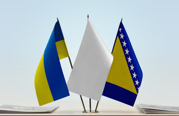 Flags of Ukraine and Bosnia and Herzegovina with a white flag in the middle