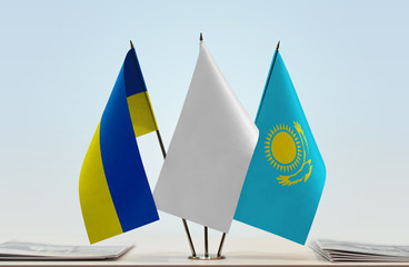 Flags of Ukraine and Kazakhstan with a white flag in the middle