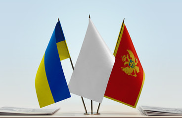 Flags of Ukraine and Montenegro with a white flag in the middle