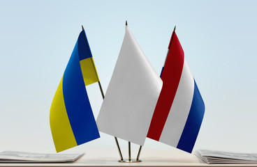 Flags of Ukraine and Netherlands with a white flag in the middle