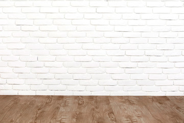 White brick wall and wood floor.