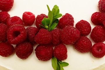 Delicious, sweet cake with red berries fresh ripe raspberries.