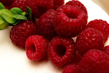 Delicious, sweet cake with red berries fresh ripe raspberries.