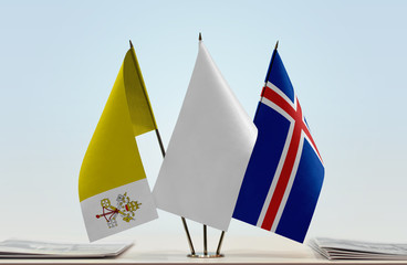 Flags of Vatican City and Iceland with a white flag in the middle