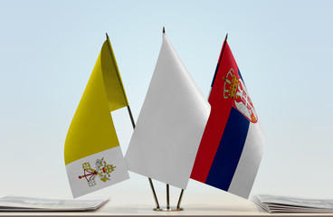 Flags of Vatican City and Serbia with a white flag in the middle