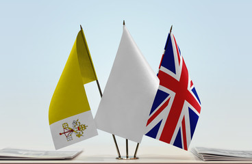 Flags of Vatican City and Great Britain with a white flag in the middle