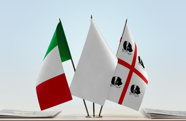 Flags of Italy and Sardinian nationalism with a white flag in the middle