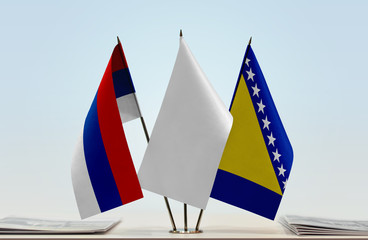 Flags of Republika Srpska and Bosnia and Herzegovina with a white flag in the middle
