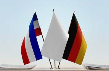 Flags of Schleswig-Holstein and Germany with a white flag in the middle