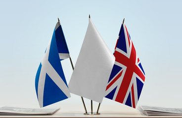Flags of Scotland and Great Britain with a white flag in the middle