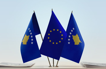 Two flags of Kosovo and European Union flag between