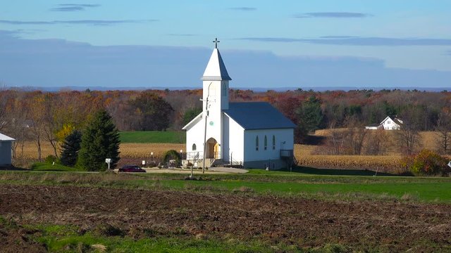 A pretty white church in the countryside.
