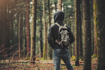 Naklejka premium Young explorer in the woods