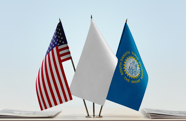 Flags of USA and South Dakota with a white flag in the middle
