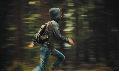 Man running in the forest - obrazy, fototapety, plakaty