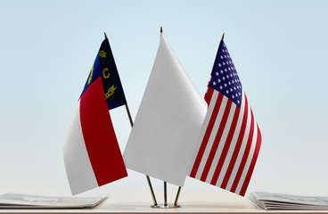 Flags of North Carolina and USA with a white flag in the middle