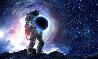 Obraz na płótnie Canvas Spaceman carrying his mission. Mixed media