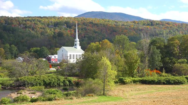 Time lapse of the church and steeple at Stowe Vermont perfectly captures small town America or New England beauty.
