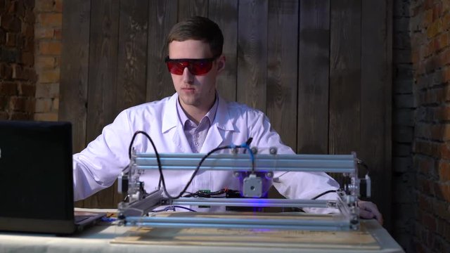 The laser does engraving on the skin.