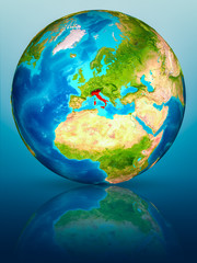 Italy on Earth on reflective surface