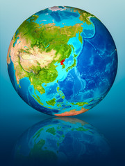 Obraz premium North Korea on Earth on reflective surface