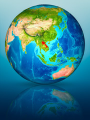 Obraz premium Laos on Earth on reflective surface