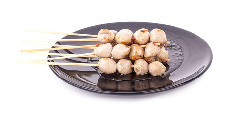 Grilled meat ball with sweet spicy sauce isolated on white.